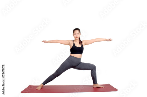 young asian woman doing yoga in Crescent Lunge, Twist yoga pose on the mat isolated on white background, exercise fitness, sport training, healthy lifestyle concept