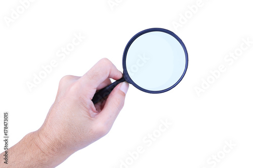 Magnifier glass in man hand isolated on white background