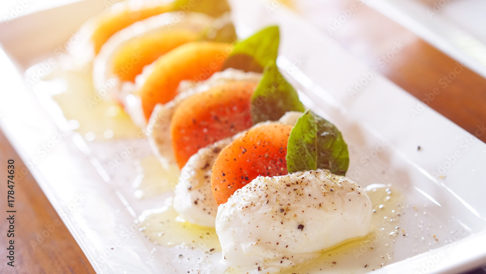 Mozzarella cheese with tomatoes and olive oil Mozzarella cheese with tomatoes and olive oil