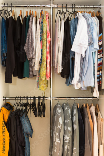 Wardrobe order. Capsule closet. Woman. Clothes.  © AlesiaKan