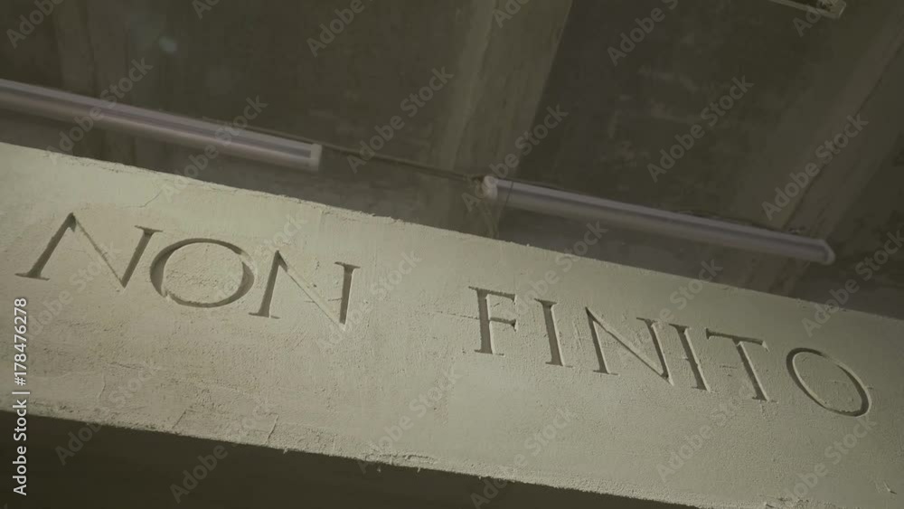 The inscription that means it is not the end on the grey wall. Isolated