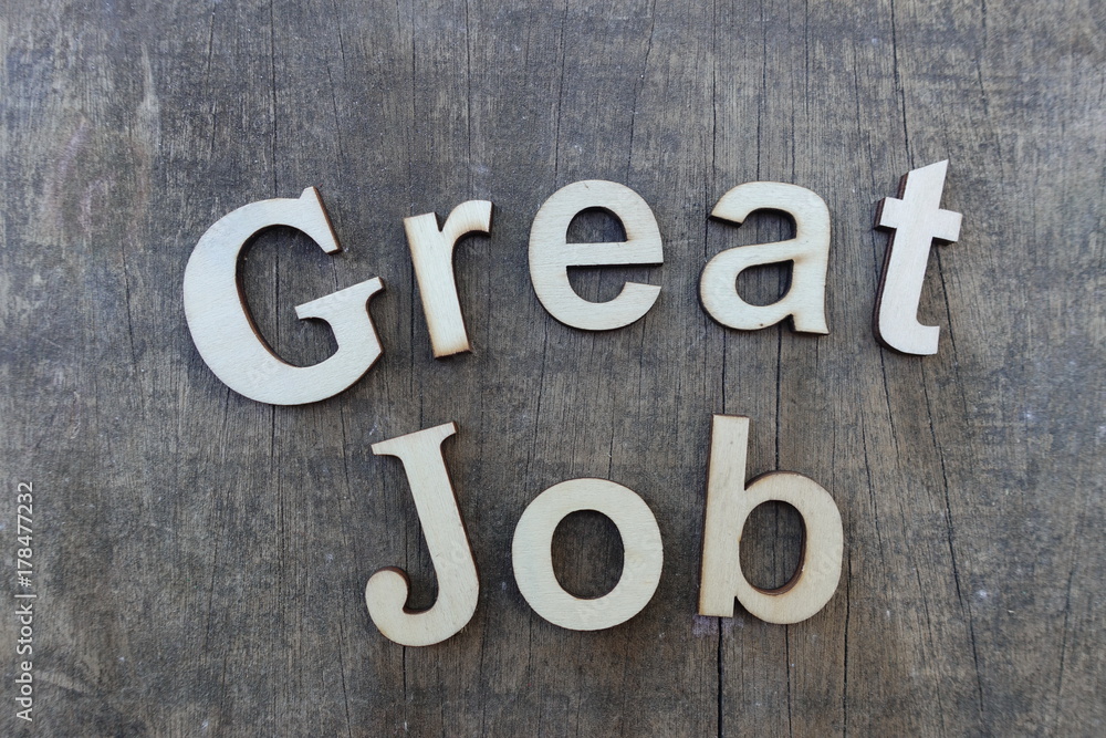 Fototapeta premium Great Job text with wooden letters over wooden board