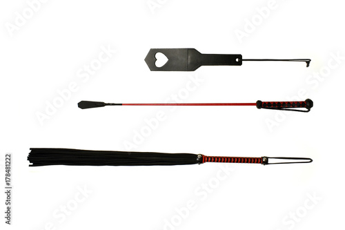 Sex toy stock images. Leather whips. Leather slap on a white background. BDSM tool