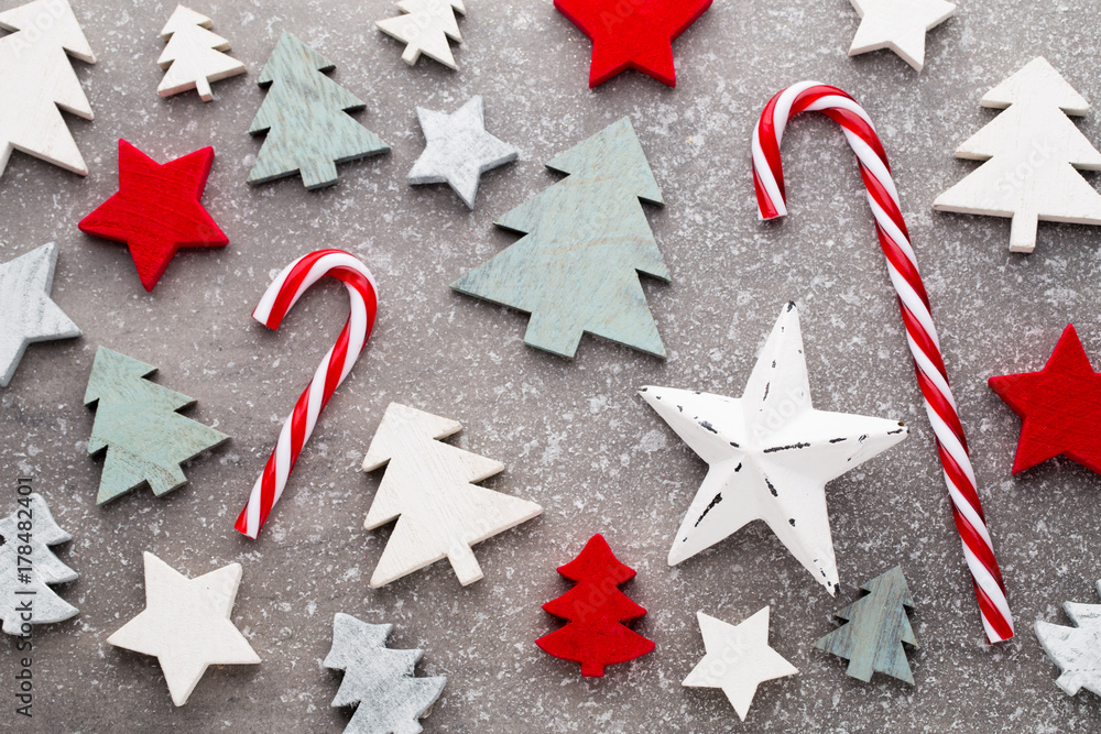 Christmas wooden decor on the snow background.