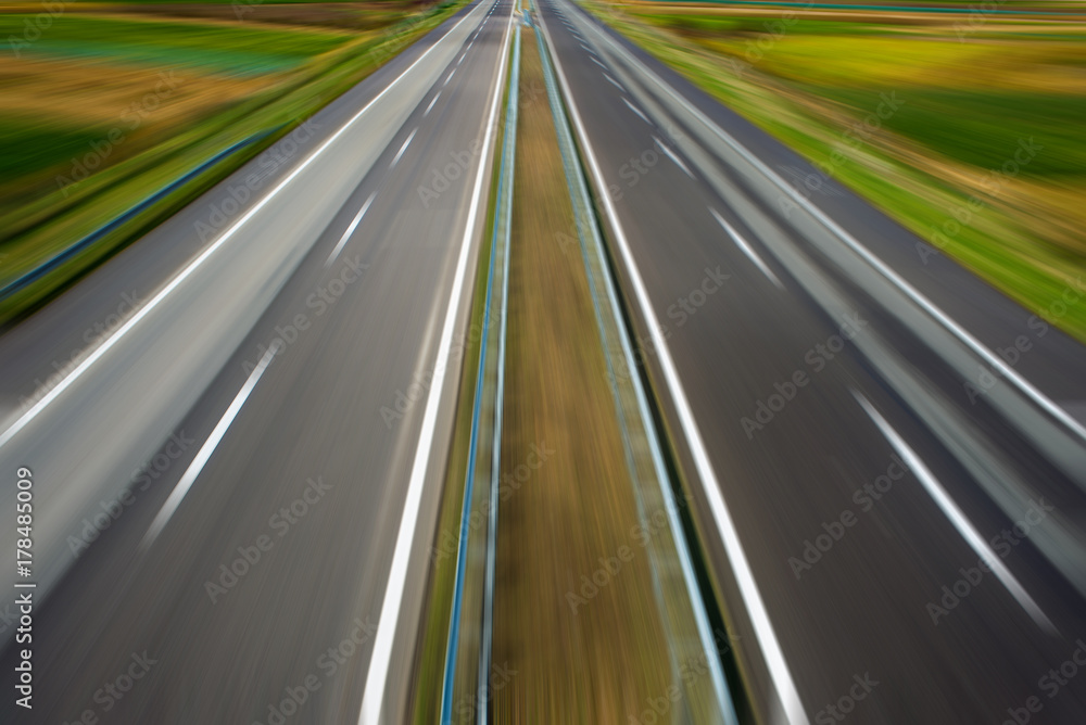 Modern highway going through fields Modern highway going through fields