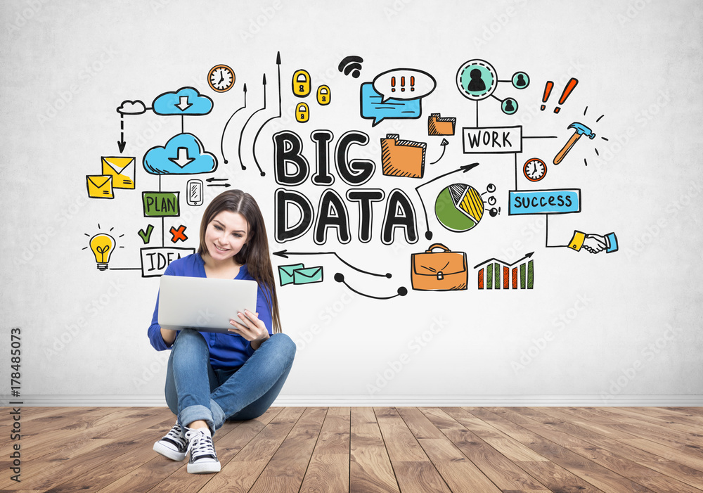 Teenage girl in jeans holding a laptop, big data Teenage girl in jeans holding a laptop, big data