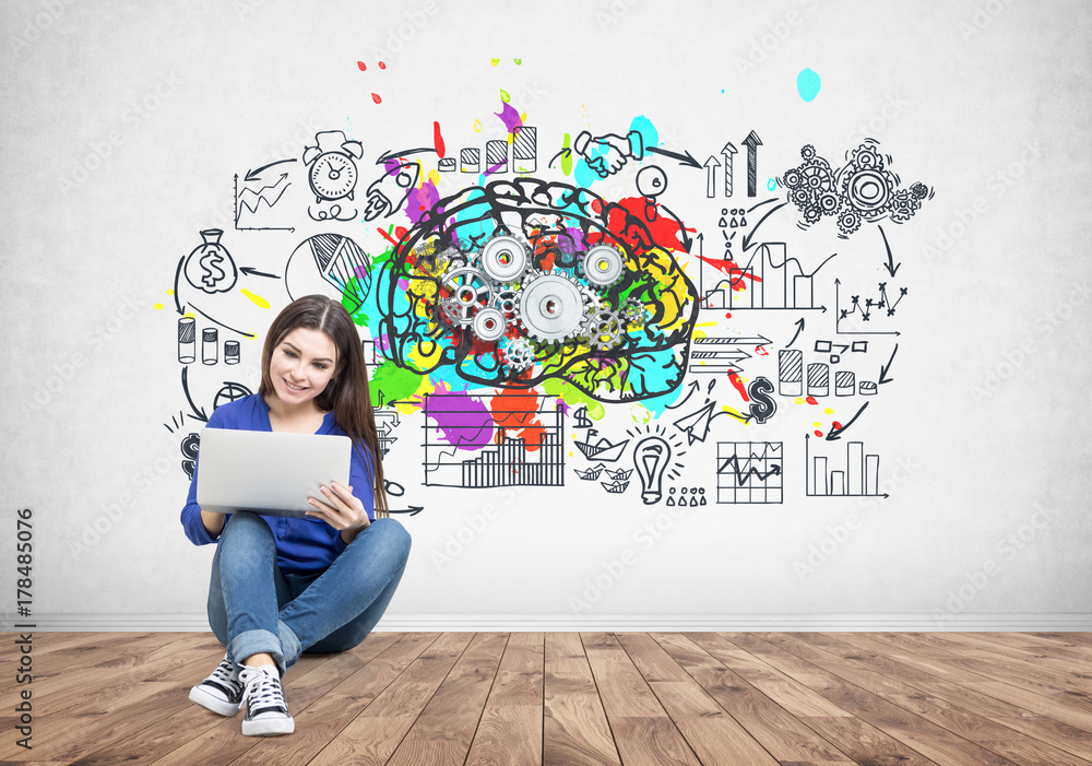 Teenage girl in jeans holding a laptop, brain cogs Teenage girl in jeans holding a laptop, brain cogs