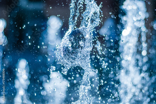 Fényképezés The gush of water of a fountain