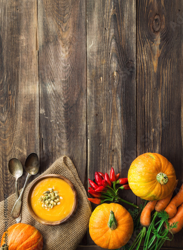 Squash soup on wooden background