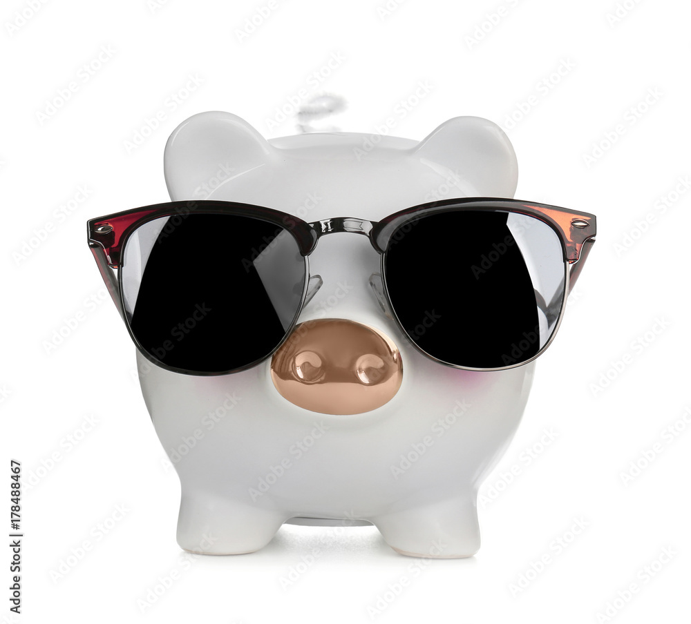 Cute piggy bank with fashionable sun glasses on white background Cute piggy bank with fashionable sun glasses on white background