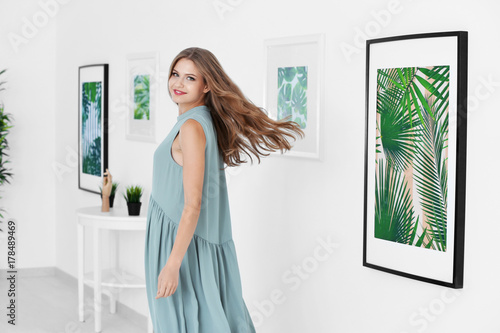 Young woman in art gallery