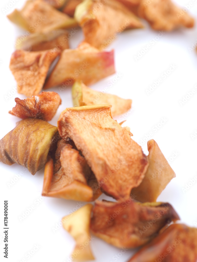 slices of dry apples on a white background