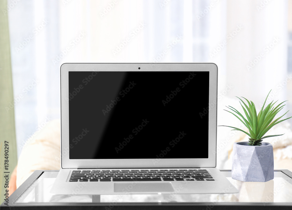 Workplace with modern laptop on table Workplace with modern laptop on table