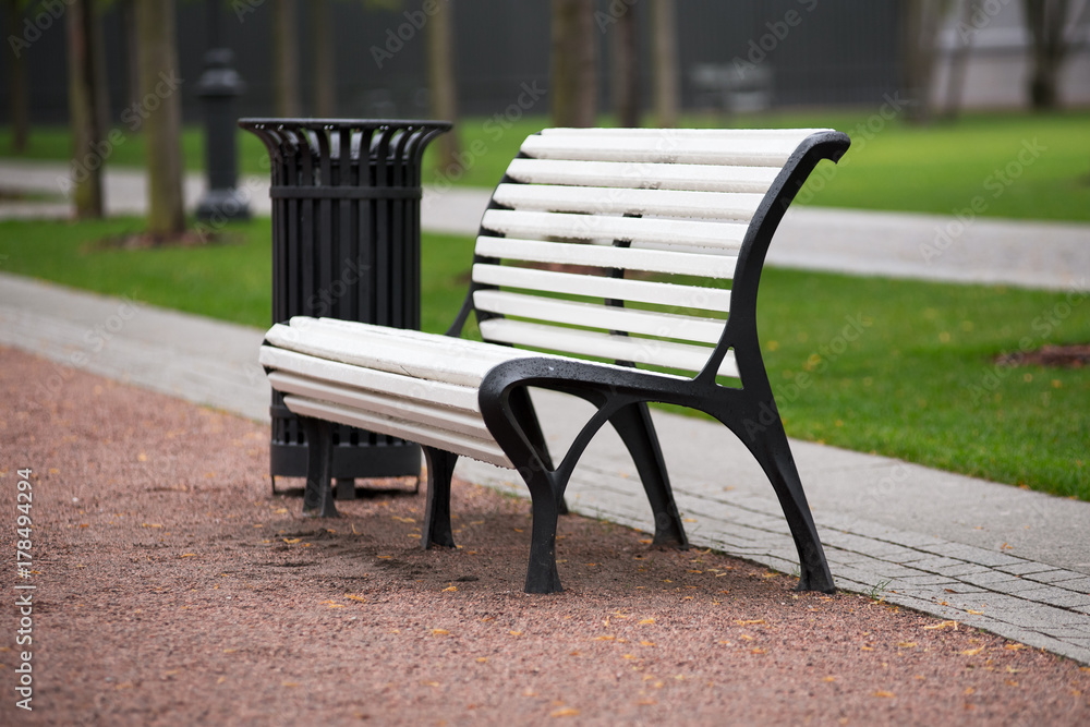 White bench in the city Park