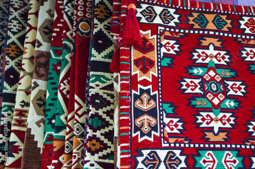 pile of turkish kilims as a colorful background handmade woven rugs and tapestry vintage carpets