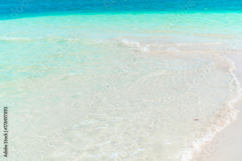 Fototapeta Naklejka Na Ścianę i Meble -  Idyllic tropical beach with white sand, turquoise ocean water and beautiful colorful sky on Caribbean island