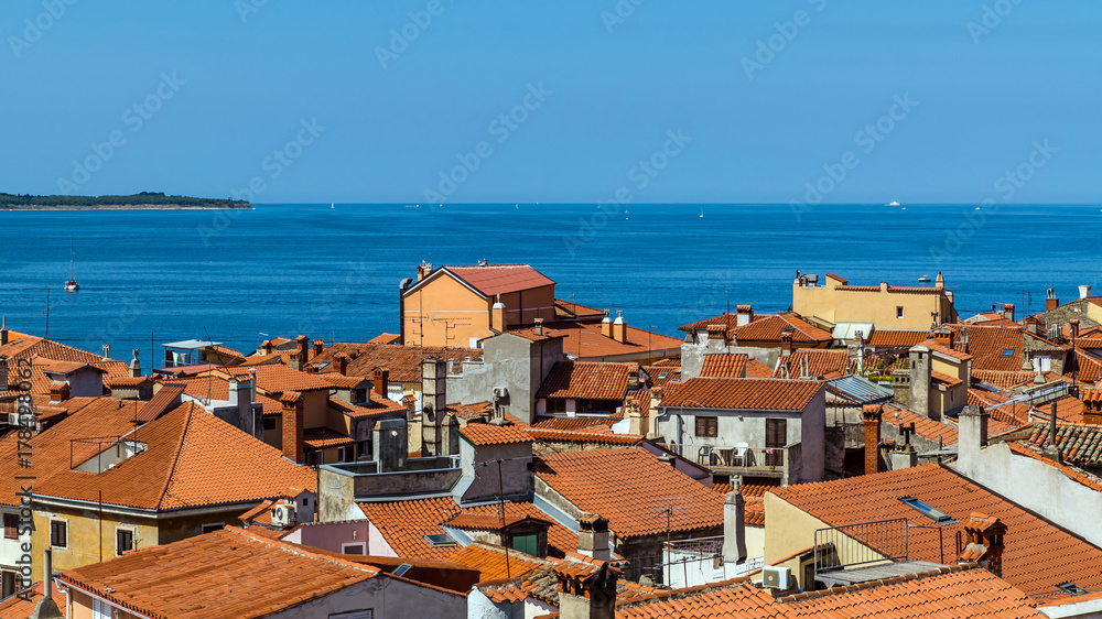 Aerial view of Piran, town on the Adriatic Sea, one of Slovenia's major tourist attractions, with medieval architecture, narrow streets and compact houses.
