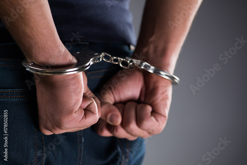 Fotografija Man with his hands handcuffed in criminal concept