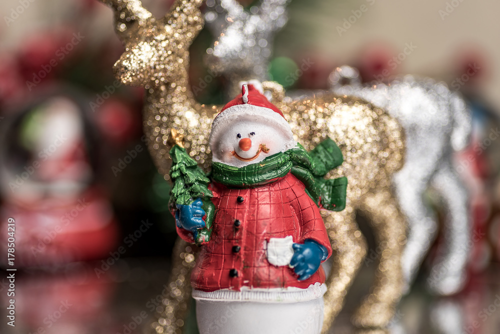 Small Christmas ornaments arranged into a holiday festive scene
Small Christmas ornaments arranged into a holiday festive scene