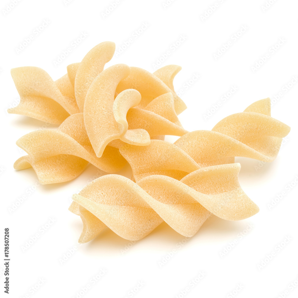 Italian twisted pasta fusilli isolated on white background. Fusilloni, rotini. Italian twisted pasta fusilli isolated on white background. Fusilloni, rotini.