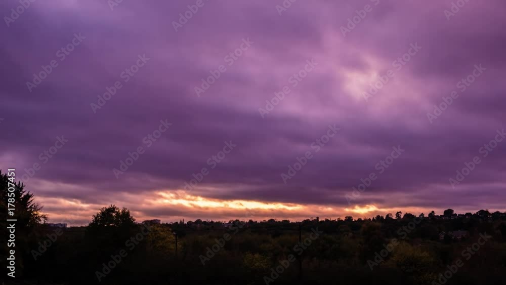 Timelapse of colourful clouds over urban skyline at New Hall Valley Country Park during sunset in Birmingham, England. Timelapse of colourful clouds over urban skyline at New Hall Valley Country Park during sunset in Birmingham, England.