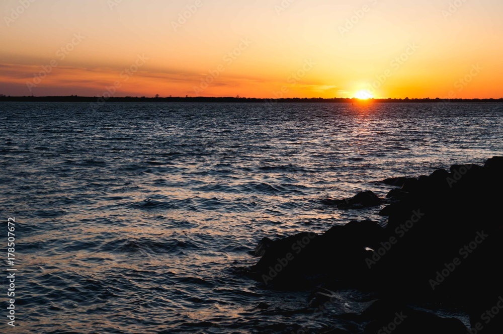 a bright sunset over the river