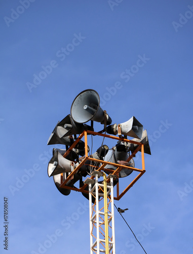 Broadcast speaker tower on blue sky background. To spread the news Let people know by themselves.