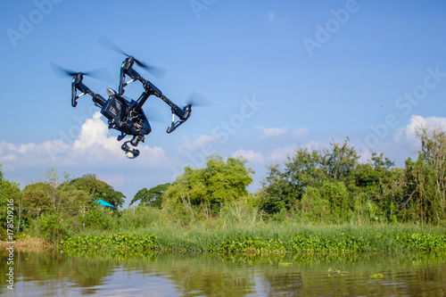 Professional camera drone fast flying.