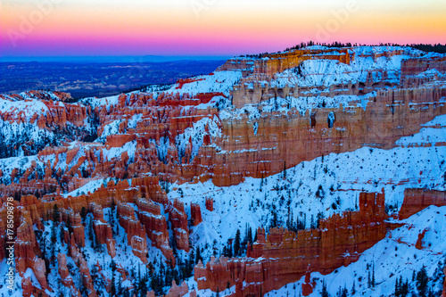 Glorious Bryce Canyon National Park in the winter with snow at sunset in Utah.