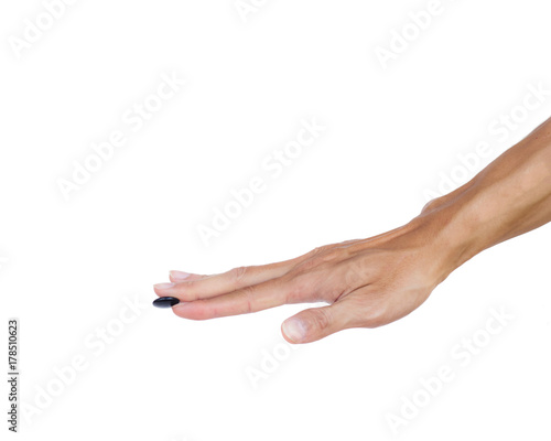 Hand holding black stones of chinese go (Board game) isolated on white background with clipping path. It the oldest board game continuously played today. photo