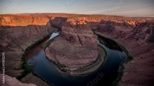 Time Lapse of Horseshoe Bend During Sunrise with Boat Moving Across River