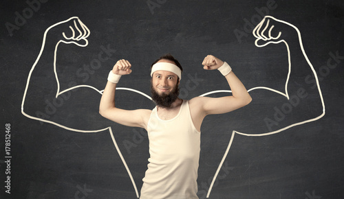 фотографія Young weak man with drawn muscles
