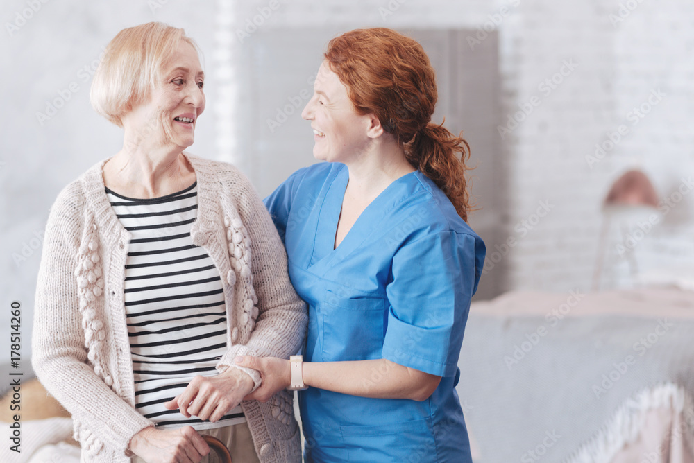 © zinkevych - Friendly nurse and female senior patient looking at each other