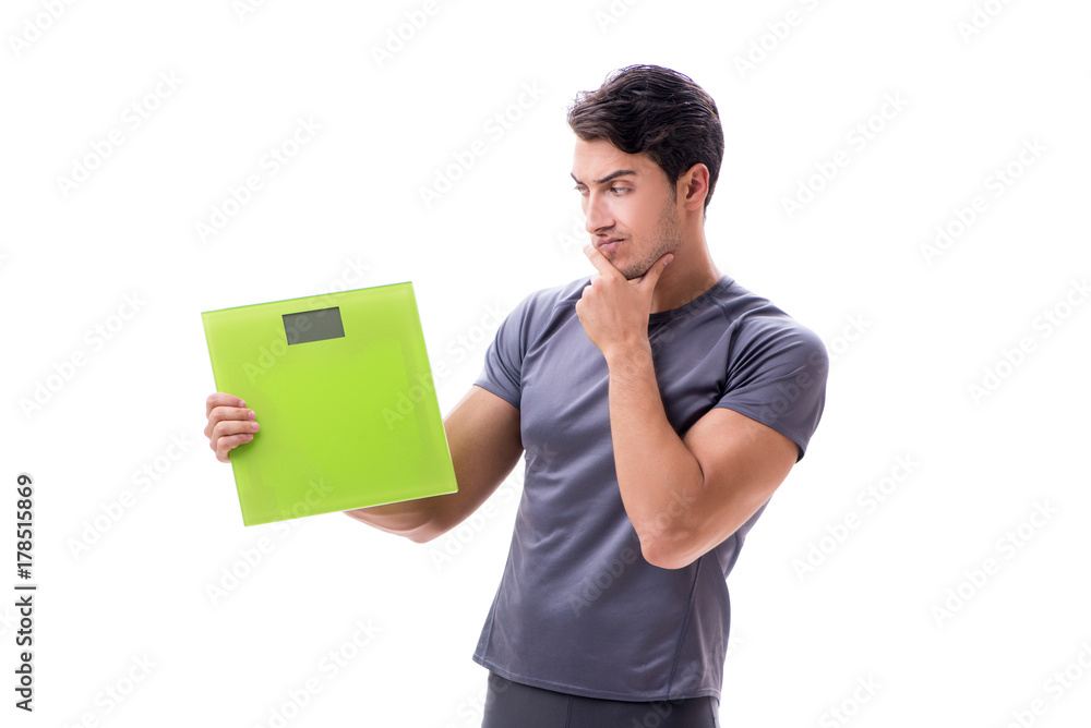 Man with scales in sports and health concept isolated on white Man with scales in sports and health concept isolated on white