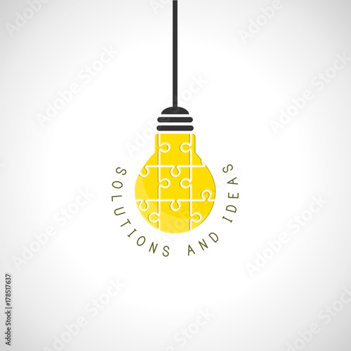 Solutions and ideas concept with hanging lightbulb made of puzzle
