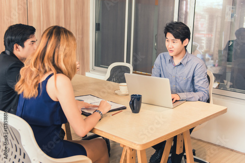 Group of Business People Working in the Office with labtop and graphic document Concept.