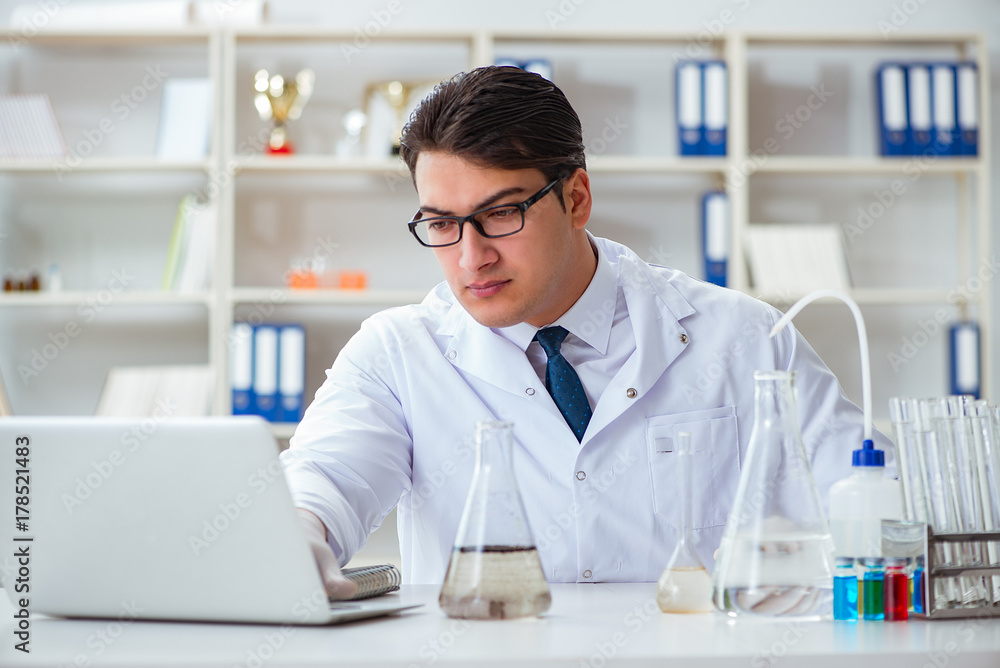 Young researcher scientist doing a water test contamination expe Young researcher scientist doing a water test contamination expe
