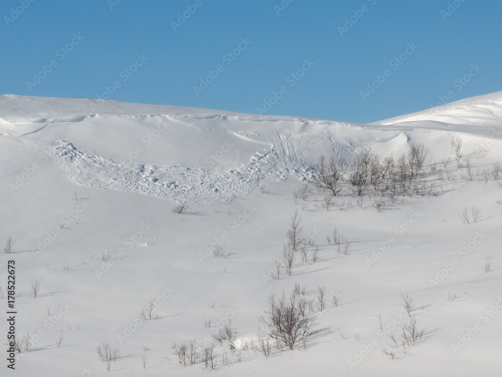 Fototapeta premium An avalanche of snow came down from the hill.