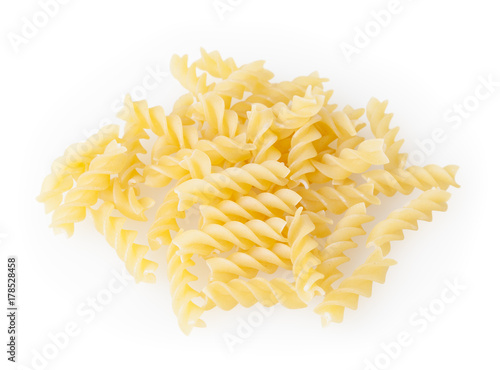 Uncooked fusilli pasta isolated on white background