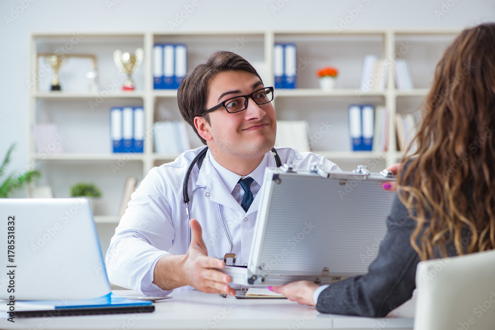 Young doctor in medical insurance fraud concept Young doctor in medical insurance fraud concept