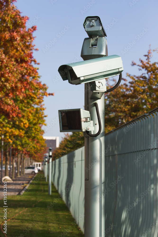 Surveillance camera with motion sensor. Perimeter security Stock Photo |  Adobe Stock