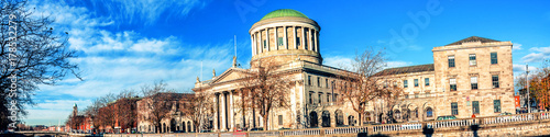 Four courts building in Dublin, Ireland with river Liffey photo