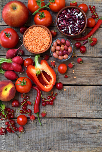 Red fruit, vegetable and bean. Apple, tomato, currant, radish, pepper, raspberries, cherry, lentils olive. Healthy food, vegetarian product. Copy space