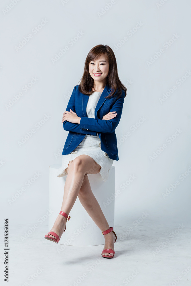 asian woman in blue suit happiness action pose in studio isolate white background asian woman in blue suit happiness action pose in studio isolate white background