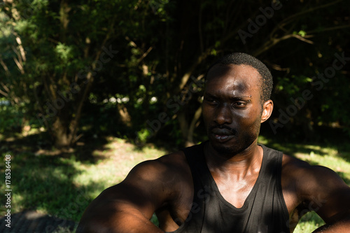 Portrait of a black man in a city park © tinx