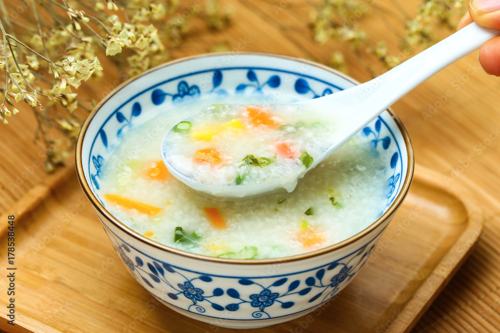 vegetable porridge in blue and white porcelain bowl vegetable porridge in blue and white porcelain bowl