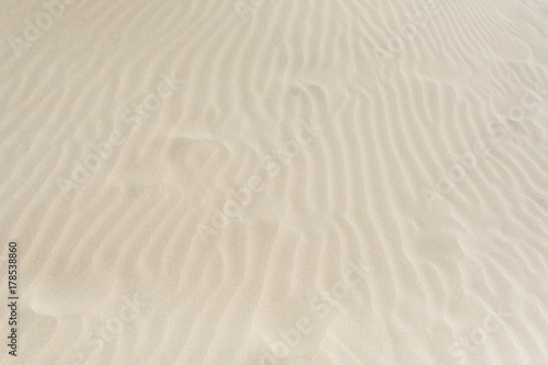 closeup of sand pattern of a beach in the summer