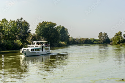passenger vessel cruising on Mincio river, Mantua, Italy