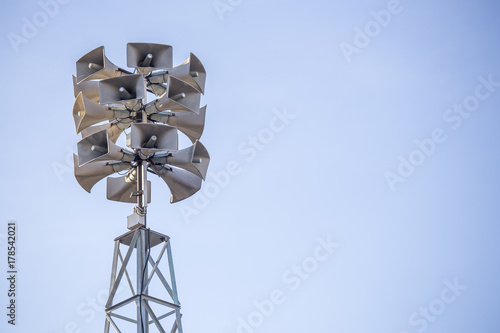 tower with bunch of loudspeakers for communication and announcing