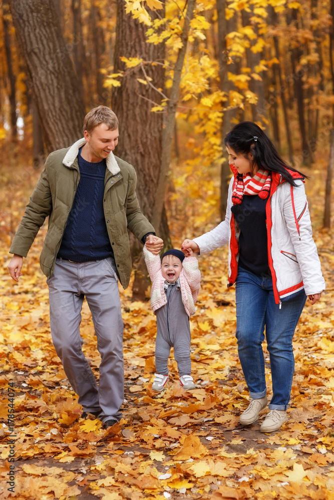 Fototapeta premium parents walk and play with little daughter